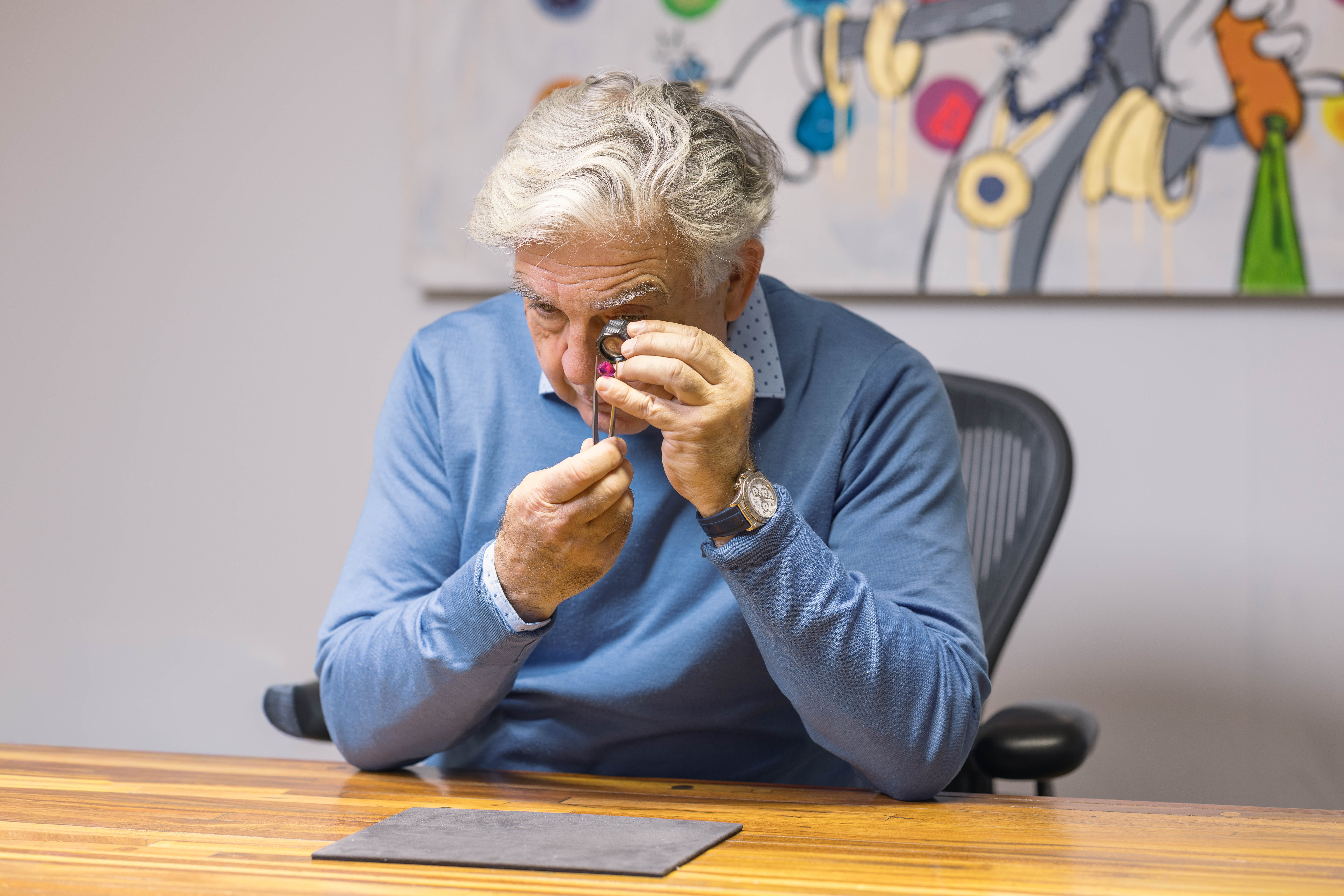 Brian examining a piece through a loupe